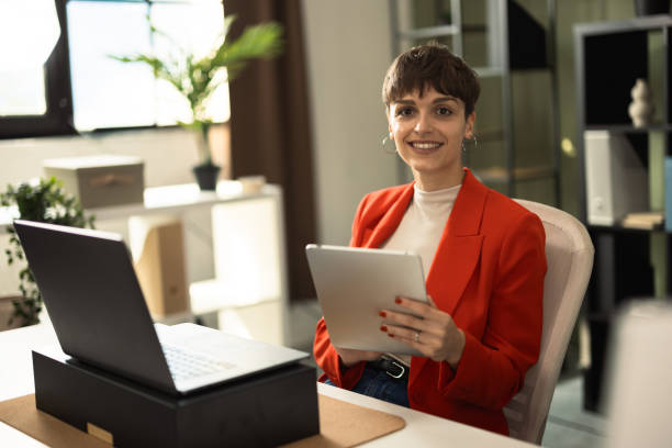 istock Determined entrepreneur managing her company from her desk 2184308150