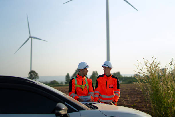 istock Engineers are working at windmills field for generate electricity. 2184308897