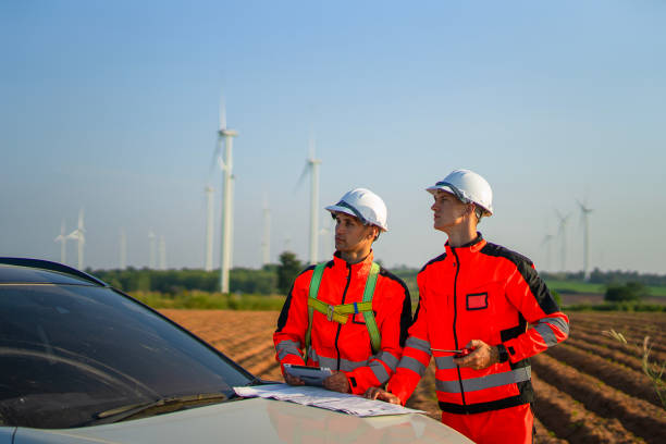 istock Engineers are working at windmills field for generate electricity. 2184308903