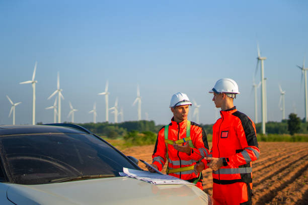 istock Engineers are working at windmills field for generate electricity. 2184308916