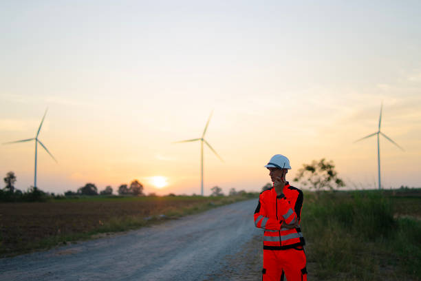istock Engineer is working at windmills field for generate electricity. 2184308964