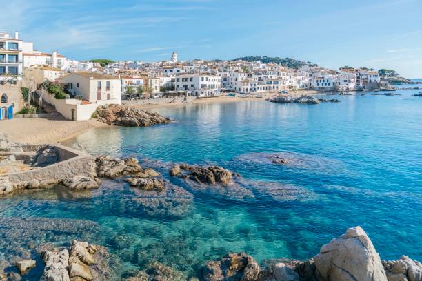istock Stunning view of Calella de Palafrugell's pristine coastline featuring traditional whitewashed Mediterranean architecture, crystal-clear turquoise waters, and dramatic rocky outcrops along Costa Brava 2184310536