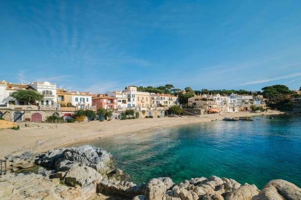 istock Stunning view of Calella de Palafrugell's pristine coastline featuring traditional whitewashed Mediterranean architecture, crystal-clear turquoise waters, and dramatic rocky outcrops along Costa Brava 2184311197