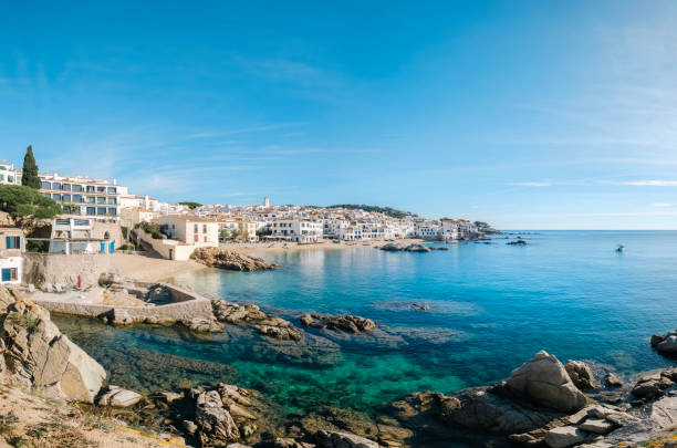 istock Stunning view of Calella de Palafrugell's pristine coastline featuring traditional whitewashed Mediterranean architecture, crystal-clear turquoise waters, and dramatic rocky outcrops along Costa Brava 2184311226
