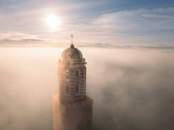 istock Peperbus church tower in Zwolle above the mist 2184315529