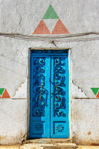 istock Colorful blue nubian door with triangle shapes pattern in Elephantine island, Aswan, Egypt 2184316396