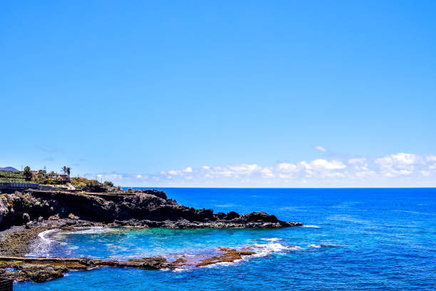 istock A beautiful blue ocean with a rocky shoreline 2184317067