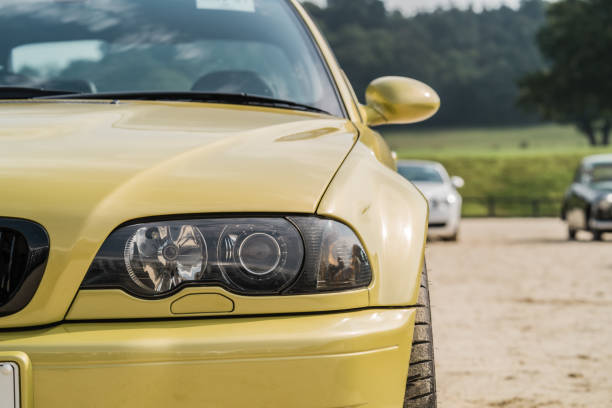 London, England, April 19, 2015: A yellow VW toy car photographed in a studio on a white background