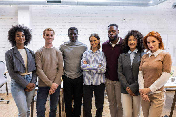 istock Diverse business team smiling together in modern office 2184320174