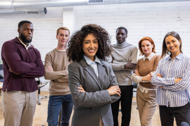 istock Diverse business team smiling with confidence in modern office 2184320320