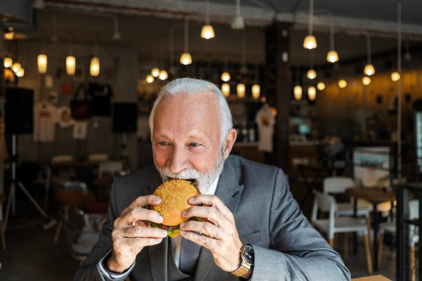 istock Senior Businessman Enjoying Breakfast 2184322058