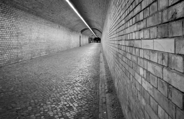 istock Tunnel with brick walls in the night 2184322069