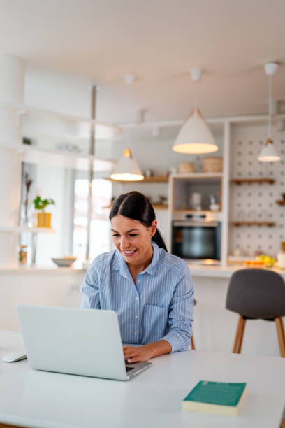istock Young beautiful woman using computer to check social media, working or read emails. 2184323038