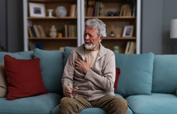 istock Senior man, widower or divorced, feeling sad, worry, abandoned and depressed, sitting alone at home, crying. Loneliness and sadness of older male with white hair and beard. 2184324979