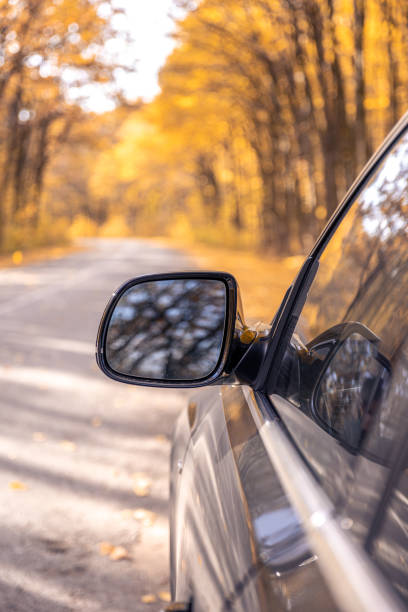 istock Rear view side mirror of a car. Seen through the rear view mirror. 2184326654