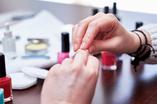 istock Woman having a manicure and painting her nails 2184327657