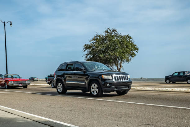 Gulfport, MS - October 04, 2023: Wide angle front corner view of a 2011 Jeep Grand Cherokee SUV at a local car show.