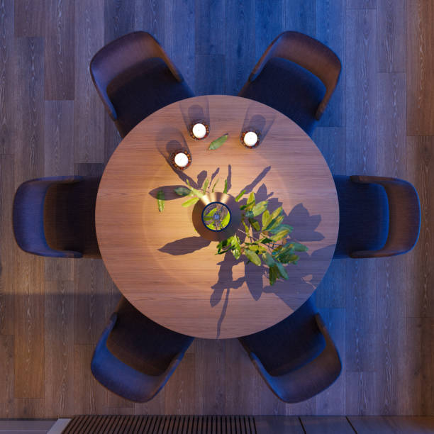 Luxury dining room interior with modern furniture and hardwood floor. top view from above. night scene