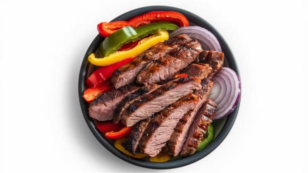 Grilled steak with bell peppers and onion.