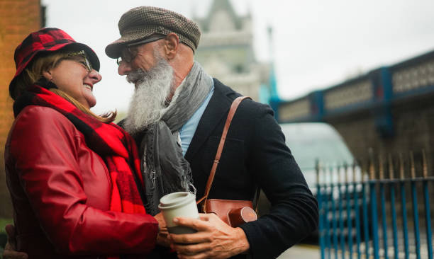 istock Happy senior couple having fun walking outdoors during winter vacation - Focus on man face - Travel and elderly joyful lifestyle concept 2184333733