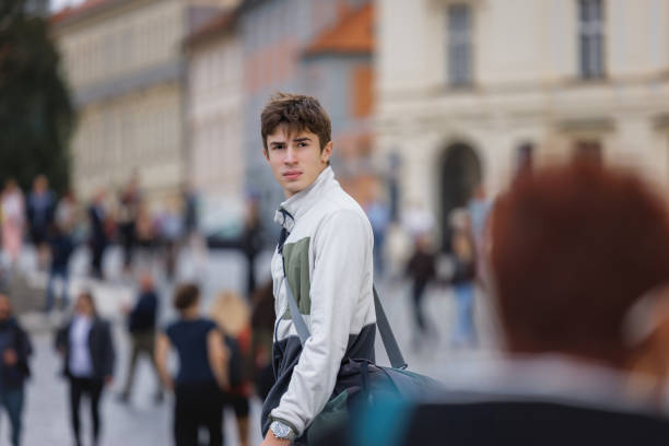 istock Young man visiting Prague, walking on the square 2184338956