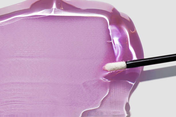 istock Make up product lip gloss or lip tint or liquid lipstick swatch with applicator brush 2184339611