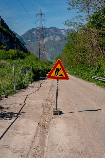 istock road signs for works in progress 2184340679