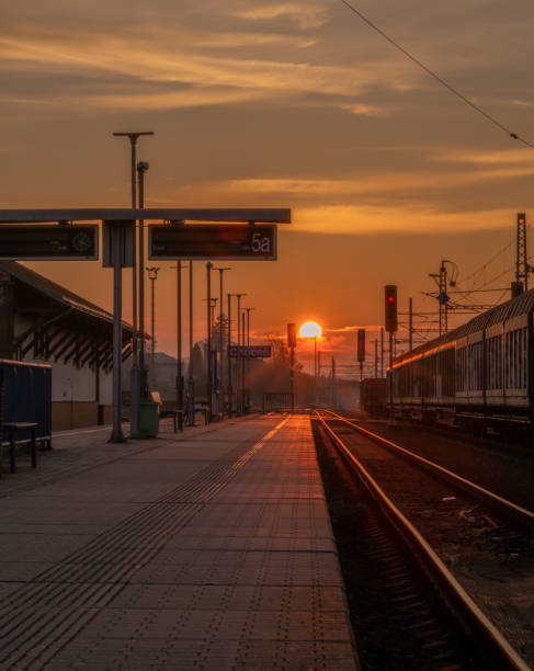 istock Sunset with railway track and railroad switch trains in Chocen CZ 11 08 2024 2184343396