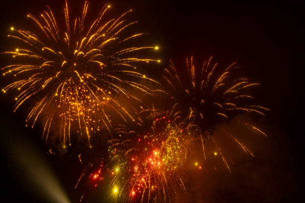 Celebrating an Event with Fireworks Multiple fireworks lighting up the sky at a display in the North East of England. firework colors stock pictures, royalty-free photos & images
