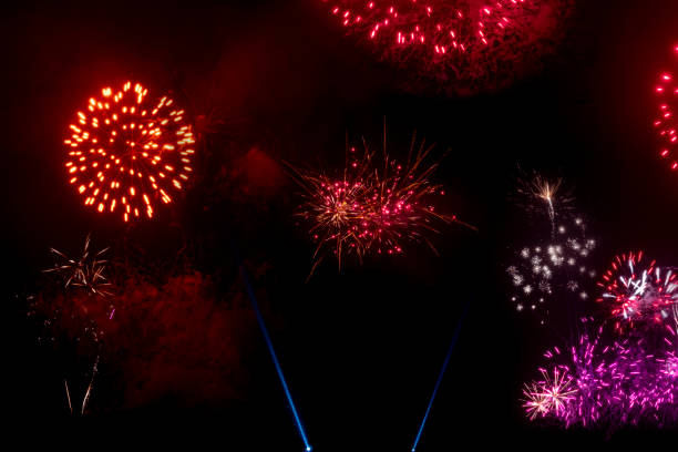 Fireworks of various color bursting blurred on  black display in festival holiday happy new year ,used background