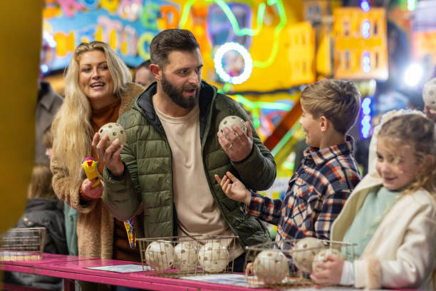 istock Family Playing a Carnival Game 2184345216