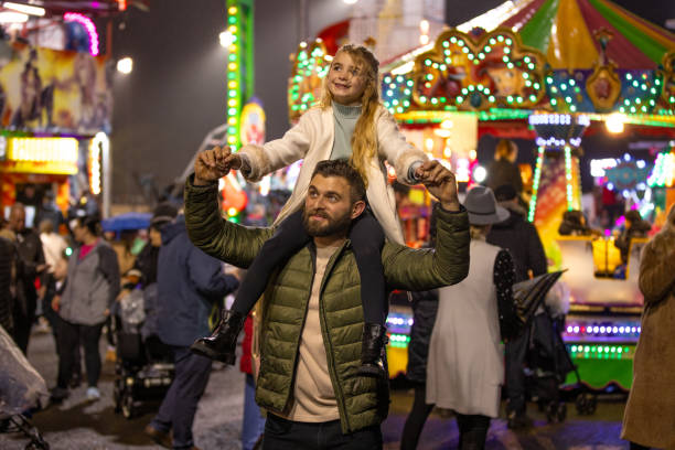 istock Father and Daughter Exploring the Fairground 2184345361