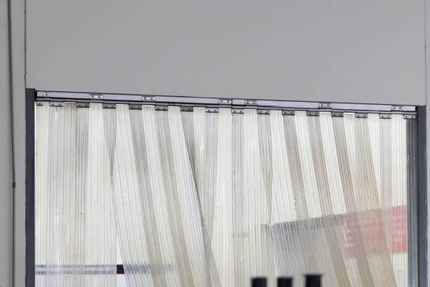 istock A window with a plastic curtain hanging in front of food cargo. 2184345827