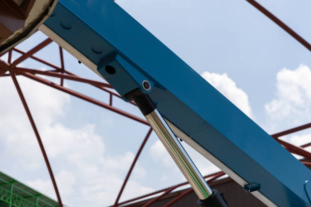 A blue and silver hydraulic crane arm.