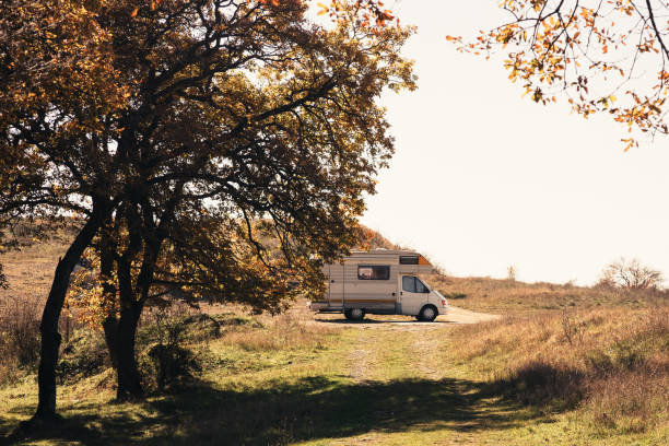 istock A serene camping spot with a camper van under autumn trees in the countryside during daylight hours 2184346039
