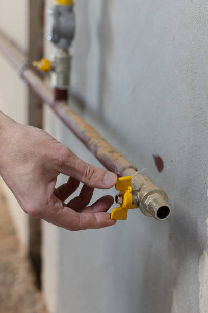 istock Male hand turns off the gas valve. 2184348675