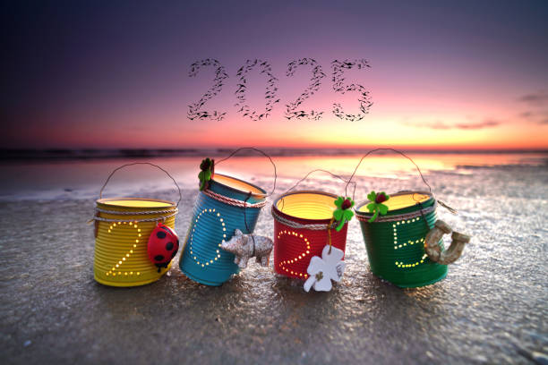 2025 lamps from cans as lantern at the beach in sunset light