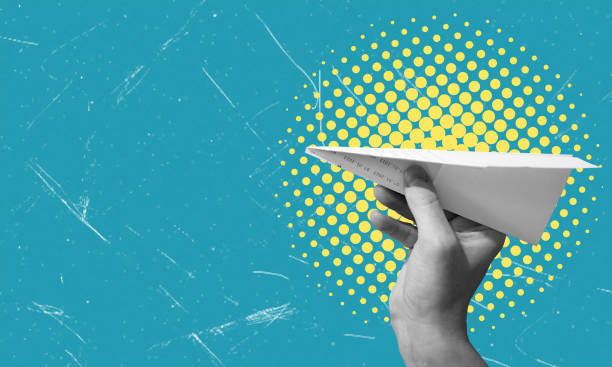 istock Modern art art collage showing a hand holding a paper airplane. 2184349253