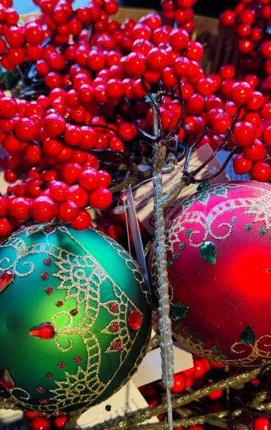 istock Christmas baubles, green and red with holly berry 2184349430
