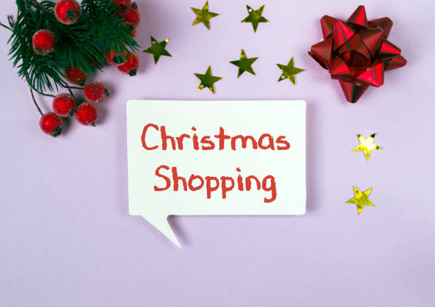 istock White sign with the words Christmas shopping written on it 2184353459