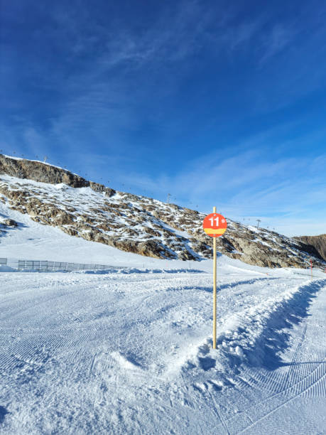 istock Number 11 on a wooden sign in mountains 2184354464