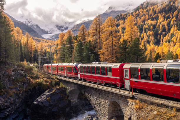 istock Swiss red train in Autumn mountain scenery 2184356552