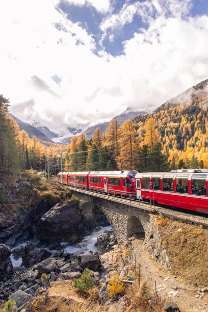istock Swiss red train in Autumn mountain scenery 2184356741