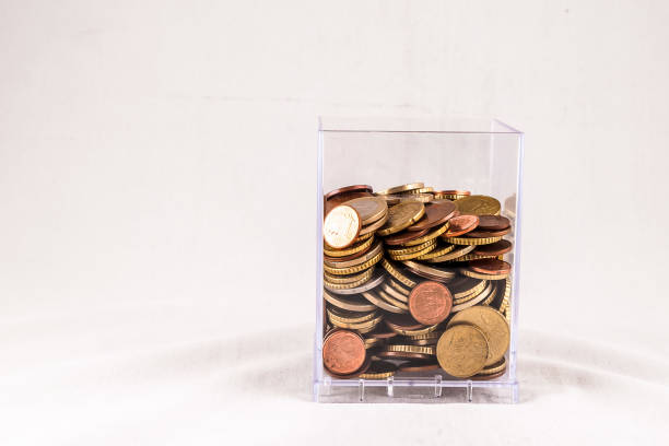 Piggy Bank with falling euro and dollar cents