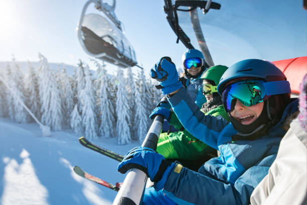 istock Family enjoying ski-lift ride together 2184362171