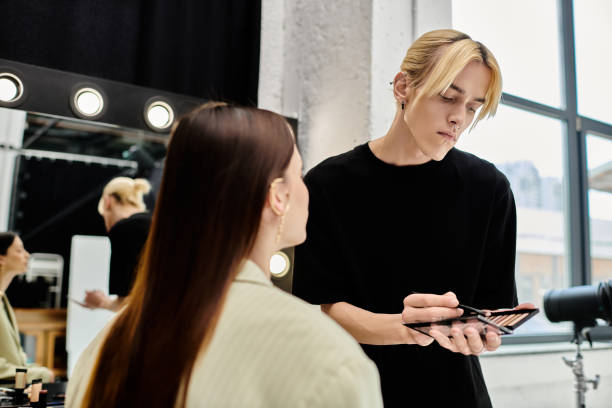 istock A young queer makeup artist creates a stunning look in a vibrant studio setting 2184363319