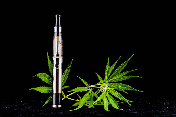 istock A silver vape is next to a leafy green marijuana plant 2184366206