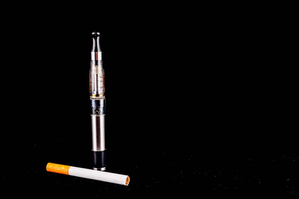 istock A cigarette and a vape are on a black background 2184366227