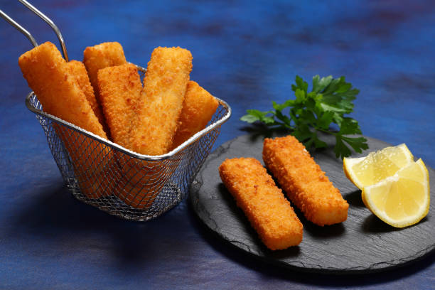 istock Freshly fried Fish Fingers with a lemon zest 2184366972