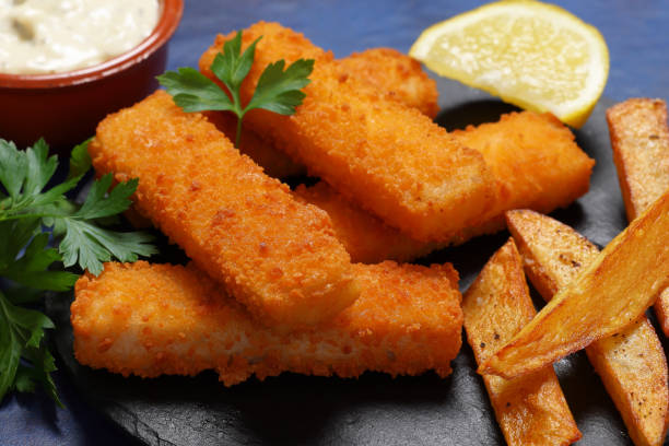 istock Freshly fried Fish Fingers with a lemon zest 2184366994